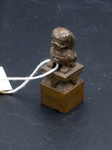 Miniature Lion on a Pedestal