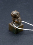 Miniature Lion on a Pedestal