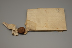 Official document written on parchment with attached wax sealing