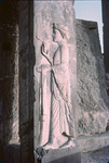 K.063 Attendant with cosmetic bottle and Towel, Western Doorway of Room 12 by Denis Baly