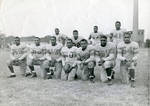 Gene Rouse (center holding football, wearing No. 40 jersey) and his Central State University football team, circa 1950