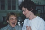 Jan Watson (left) and Marilyn Weil (right), the coordinators of the Hot Meal Program at the First Presbyterian Church in Mount Vernon, share a laugh in the kitchen. by Karla Tibbetts