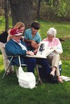 Elderly Couple looking at Photos