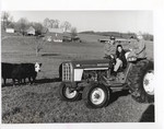 Student on a Tractor with the Hall's