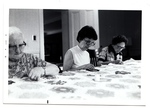 Three women sew together