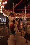 Woman rides a Merry-Go-Round