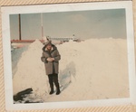 Woman Stands Near Snowbank outside WMVO