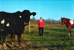 Dudgeon Farm Rita Standing with a Cow and Horse by Rita Dudgeon and Chuck Dudgeon