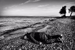 Ai Weiwei poses as drowned Syrian child Alan Kurdi in photograph by Wei-Wei AI 艾未未